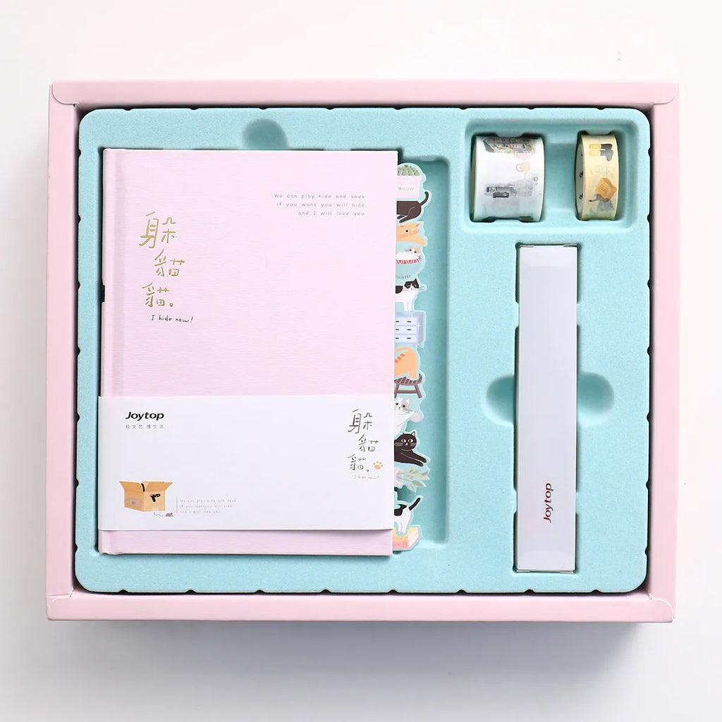 Peekaboo gift box containing a hand ledger notebook and a pen, notebook measures 13 by 18 centimetres.