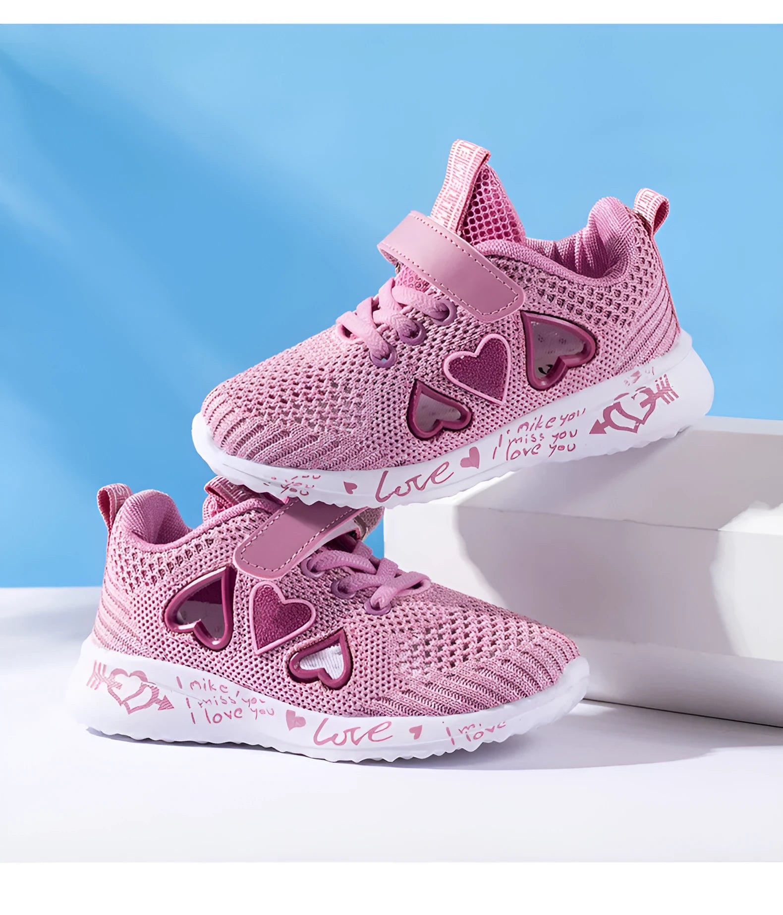 Children's pink mesh sneakers with velcro fastening and cartoon patterns