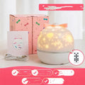 Rechargeable rotating starry projector light showing galaxy projection on a ceiling, available in six colour and style options.
