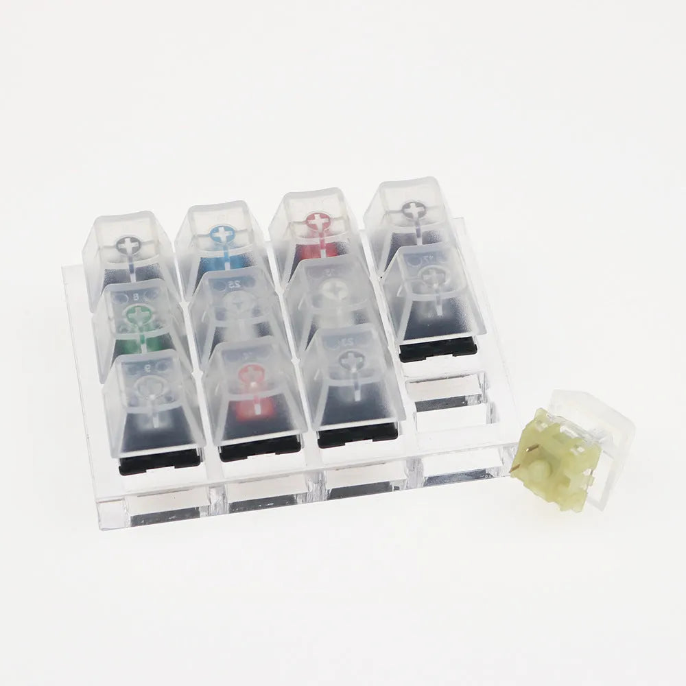 Cherry MX mechanical keyboard switch test kit with twelve different switches including Black, Green and Tea variants