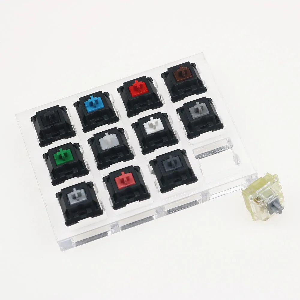 Cherry MX mechanical keyboard switch test kit with twelve different switches including Black, Green and Tea variants