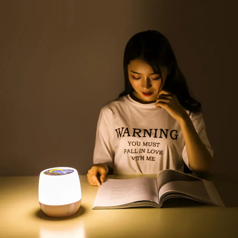 Pruixin rotating projector night light displaying star patterns on a bedroom wall.