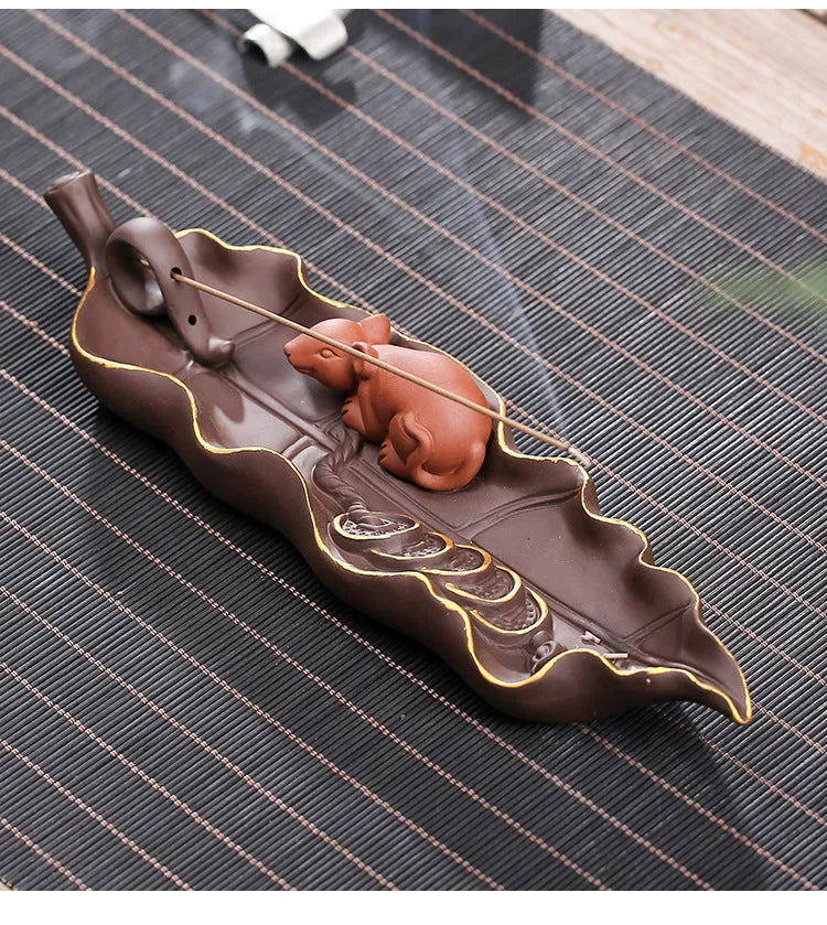 Purple clay ceramic lying incense burner with golden rat decorative design