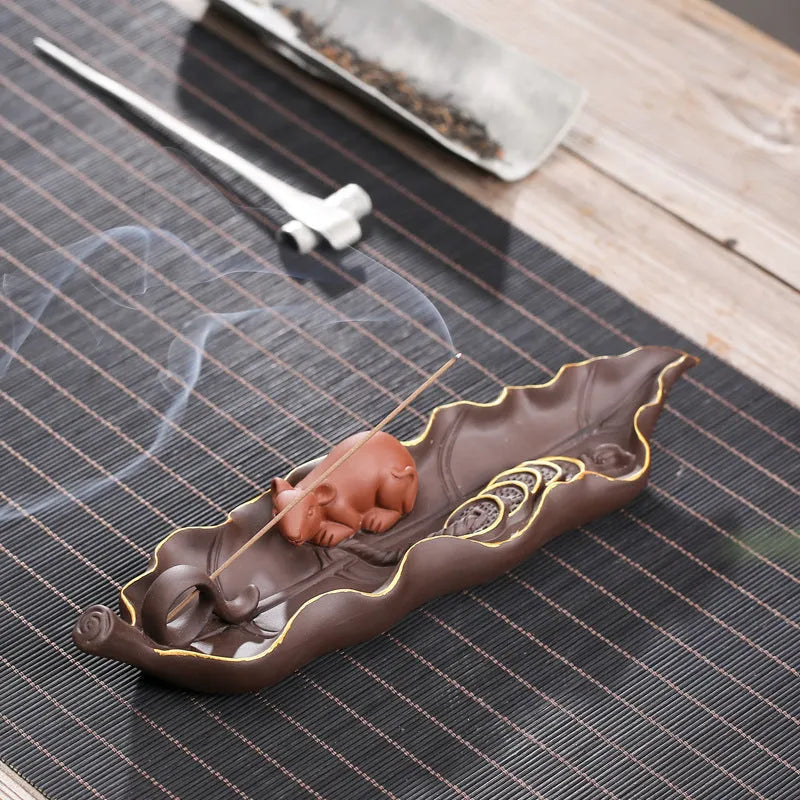 Purple clay ceramic lying incense burner with golden rat decorative design