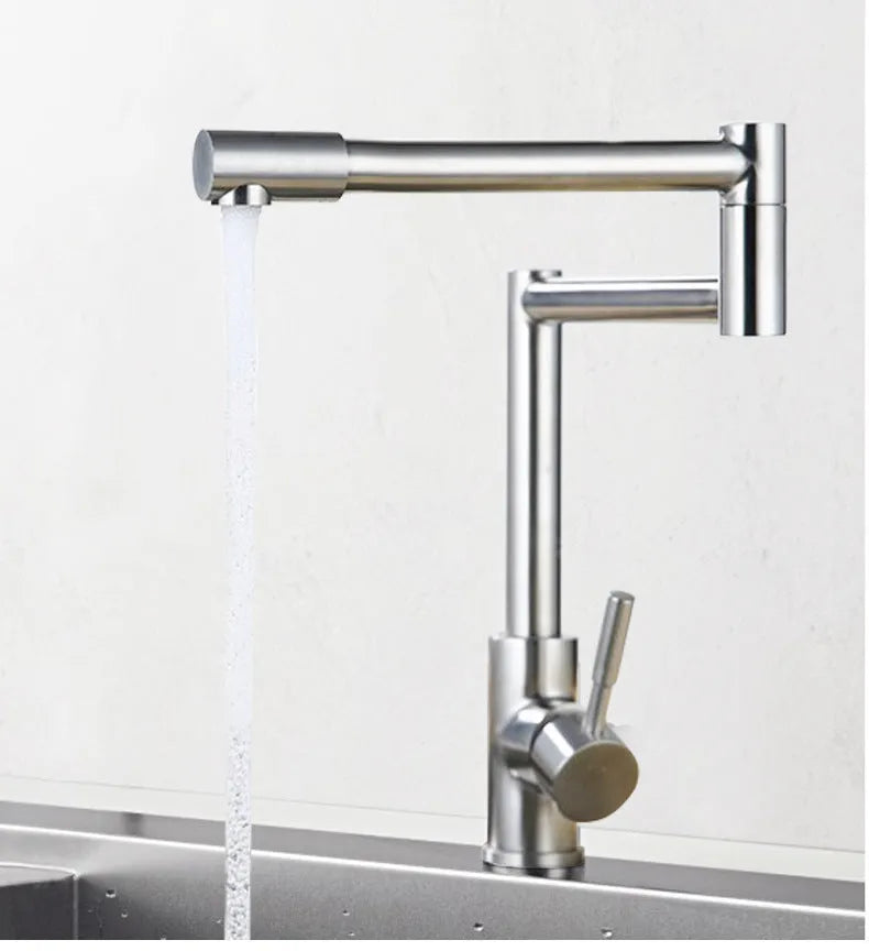 Silver stainless steel kitchen mixer tap with dual levers and rotating spout
