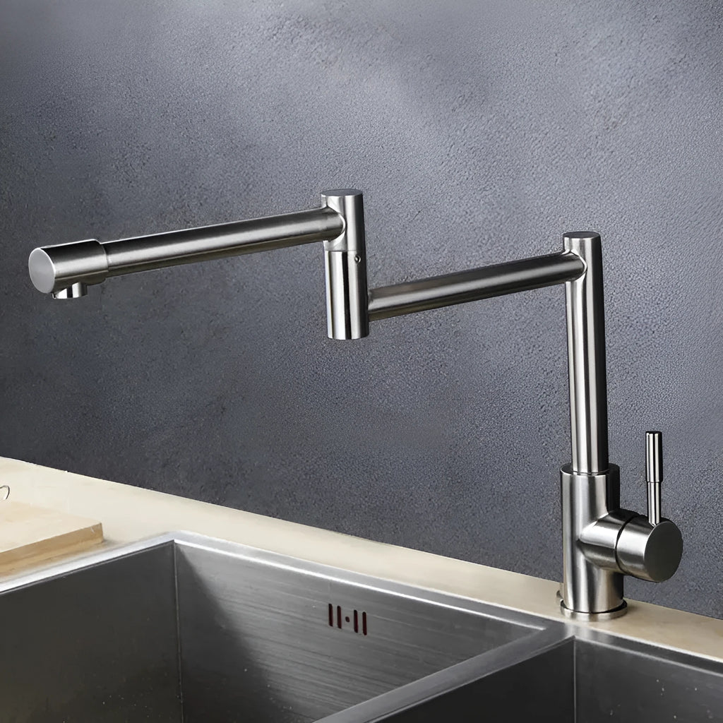 Silver stainless steel kitchen mixer tap with dual levers and rotating spout