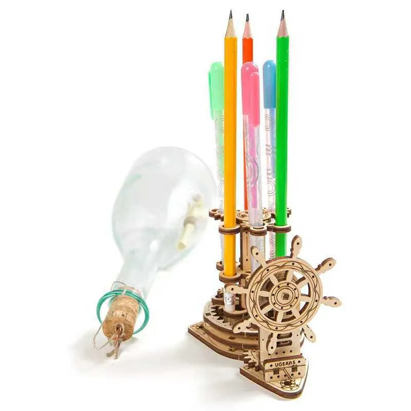 Ukrainian wooden rotating pen holder model kit with steering wheel, shown disassembled for building.