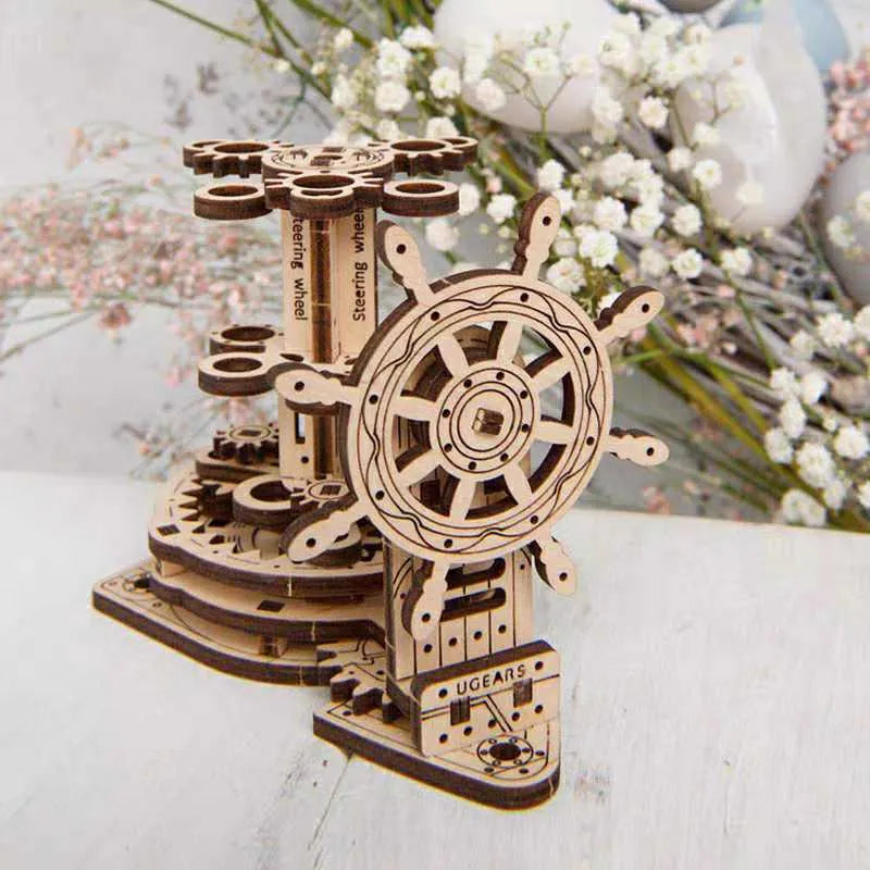 Ukrainian wooden rotating pen holder model kit with steering wheel, shown disassembled for building.