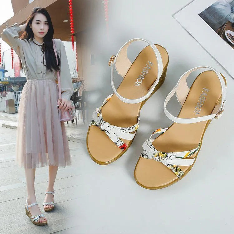 Women's pink wedge sandals with a thick heel and buckle closure on a white background.