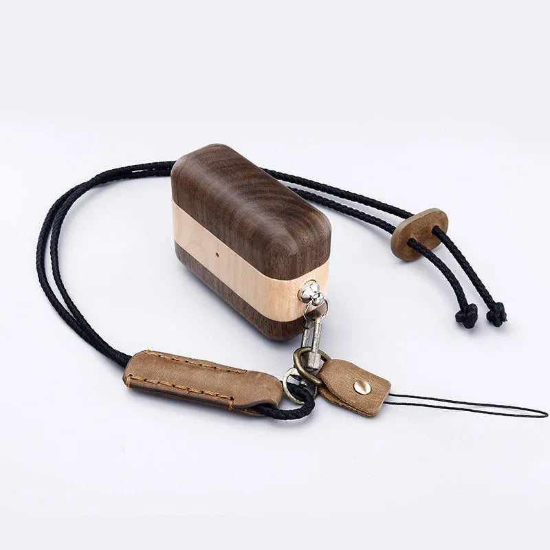 Bluetooth wireless earphones with a solid wood log shell protective case in a walnut finish.
