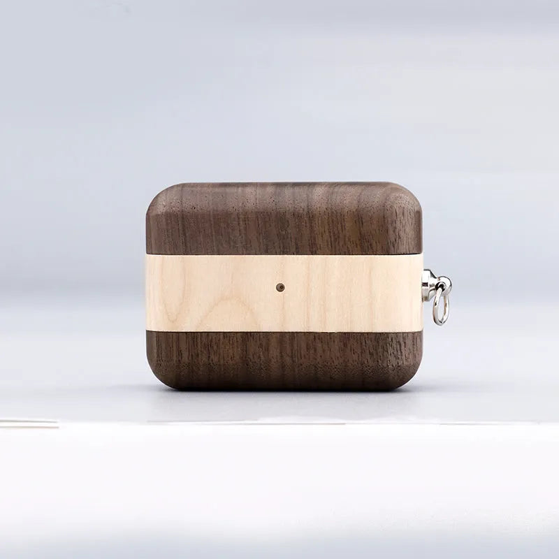 Bluetooth wireless earphones with a solid wood log shell protective case in a walnut finish.