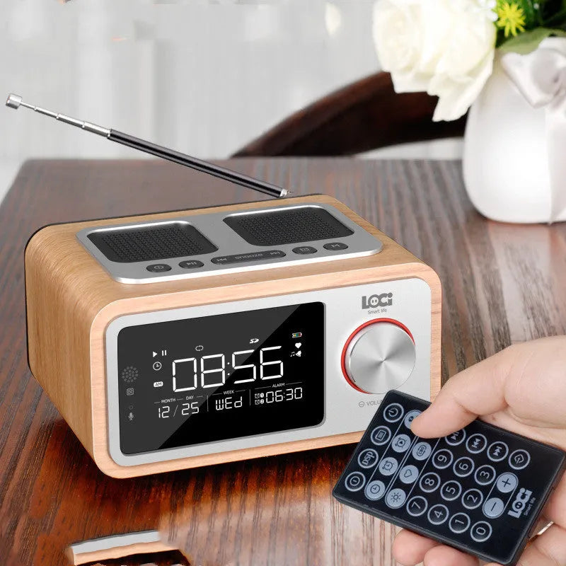 Wooden Bluetooth speaker alarm clock radio in golden oil colour showing front controls and speaker grilles
