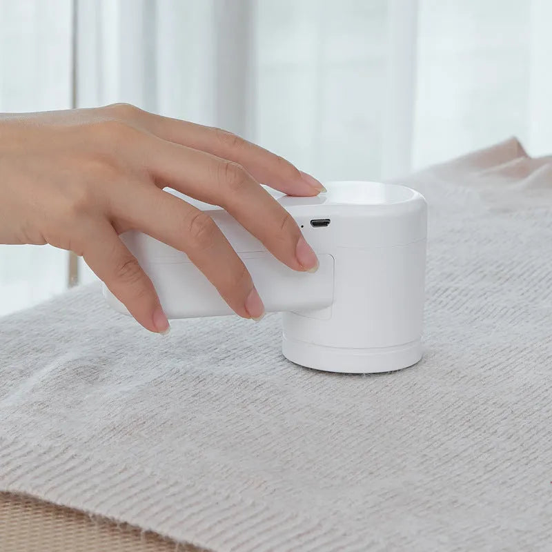 White portable electric lint remover trimmer with ABS body, rechargeable or dry battery option, and hair removal ball