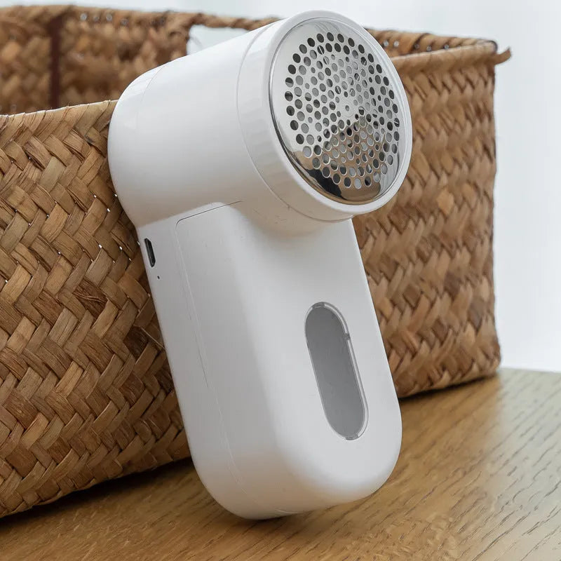 White portable electric lint remover trimmer with ABS body, rechargeable or dry battery option, and hair removal ball