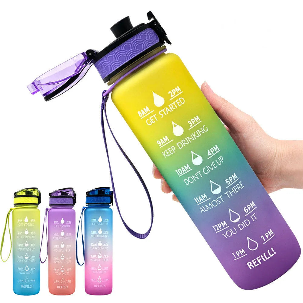 Blue and red gradient 1 litre Tritan sports water bottle with time markers and a black flip-top lid.