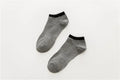 Pair of beige cotton boat socks with jacquard knit, invisible cut for low-profile wear