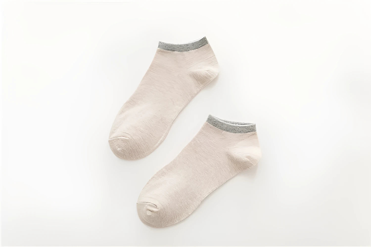 Pair of beige cotton boat socks with jacquard knit, invisible cut for low-profile wear