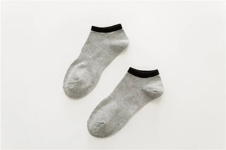 Pair of beige cotton boat socks with jacquard knit, invisible cut for low-profile wear