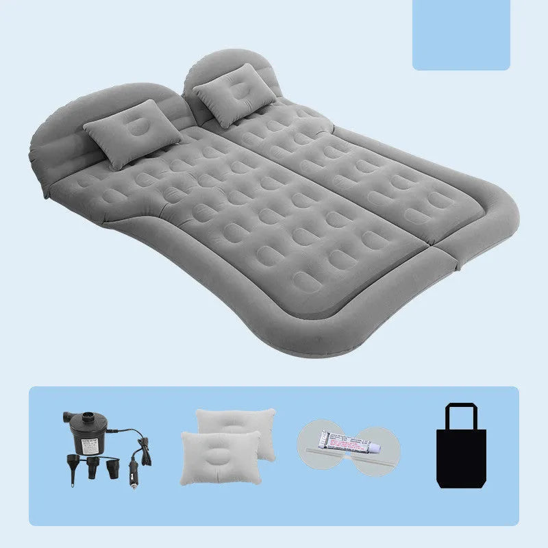 Inflatable car mattress for SUV with flocking surface, two pillows, and air pump folded on storage bag