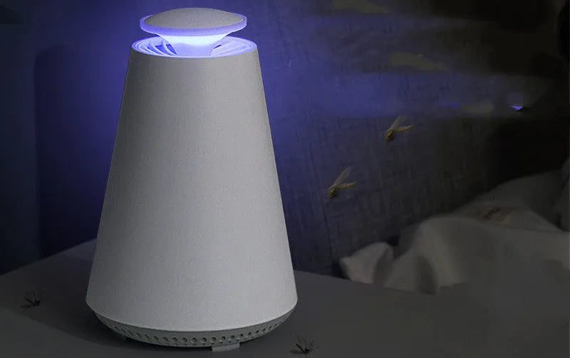 Photocatalyst mosquito lamp in ivory white with USB cord on a desk