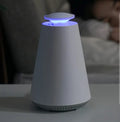 Photocatalyst mosquito lamp in ivory white with USB cord on a desk