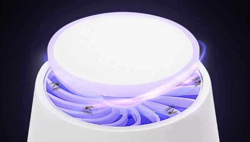 Photocatalyst mosquito lamp in ivory white with USB cord on a desk