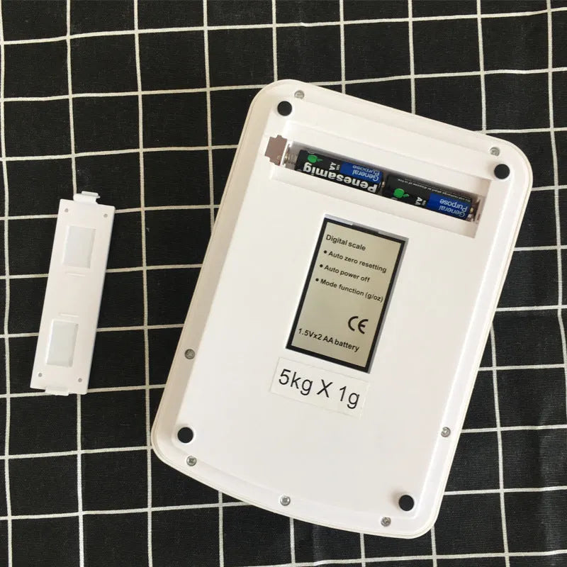 SF-400A black electronic digital kitchen scale with LCD display on a kitchen counter.