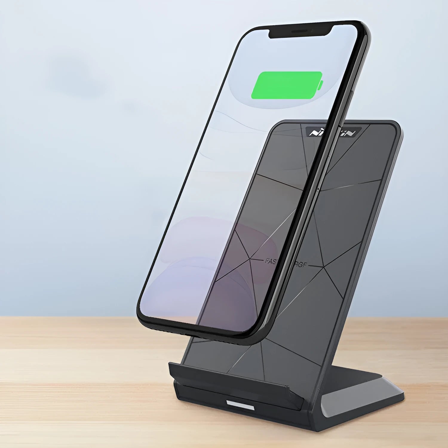 Vertical Pro Fast Wireless Charger in black, standing upright on a desk with a phone placed against the vertical pad.