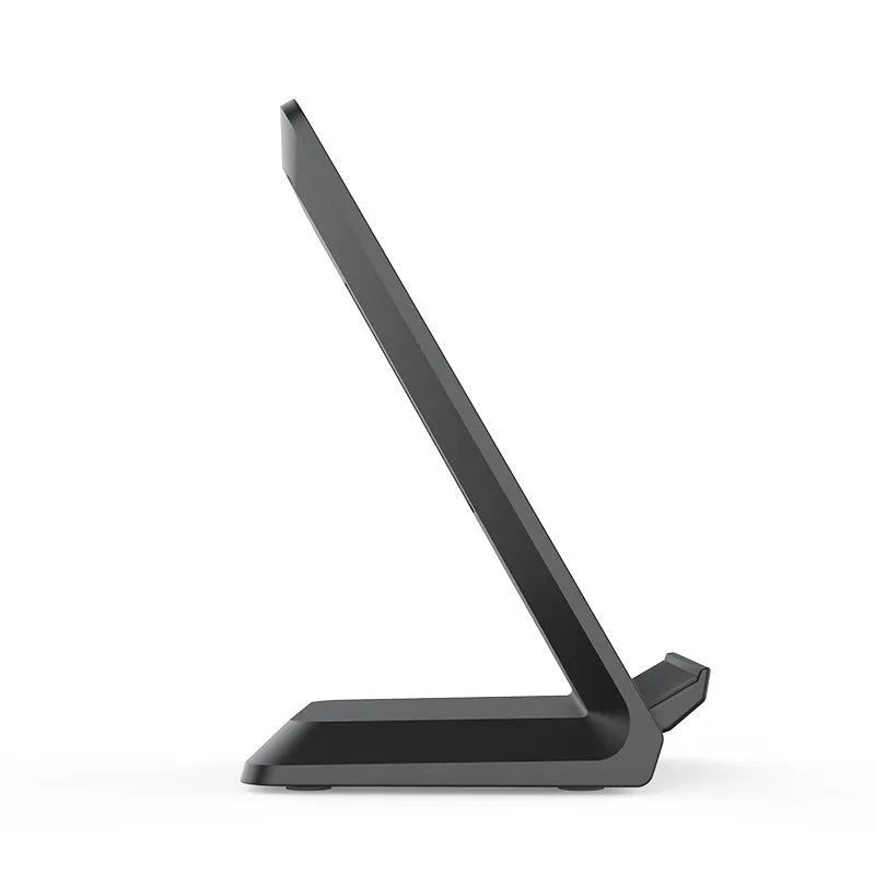 Vertical Pro Fast Wireless Charger in black, standing upright on a desk with a phone placed against the vertical pad.