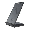 Vertical Pro Fast Wireless Charger in black, standing upright on a desk with a phone placed against the vertical pad.