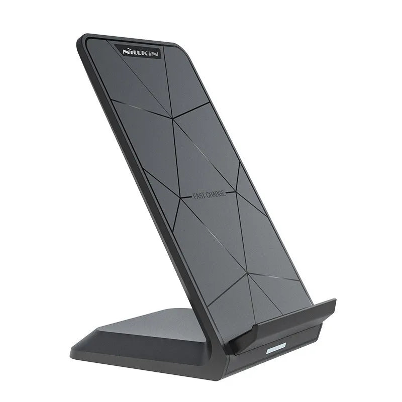 Vertical Pro Fast Wireless Charger in black, standing upright on a desk with a phone placed against the vertical pad.