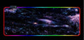 Large gaming mouse pad with colourful skull pattern on a black gaming desk setup
