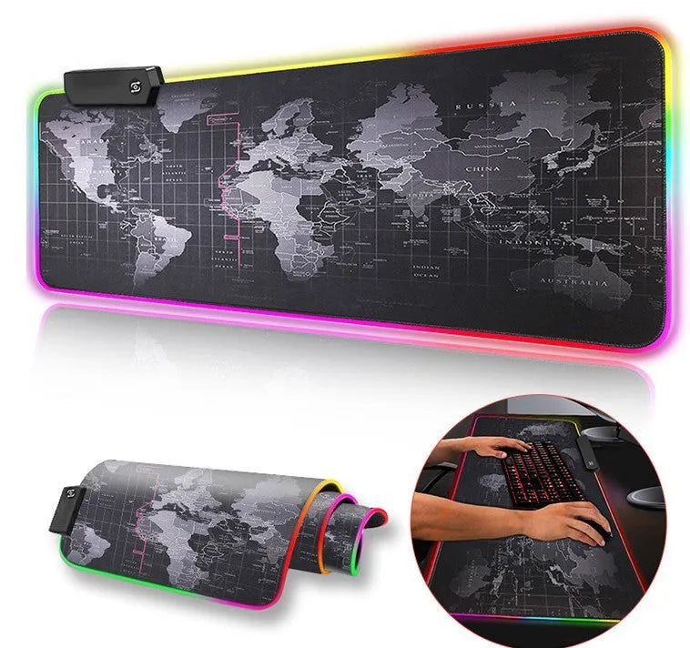 Large gaming mouse pad with colourful skull pattern on a black gaming desk setup