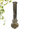 Pure colour transparent glass sitting vase with American geometric shape on a table.
