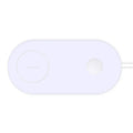 White dual wireless charger charging two mobile phones simultaneously on simple desk