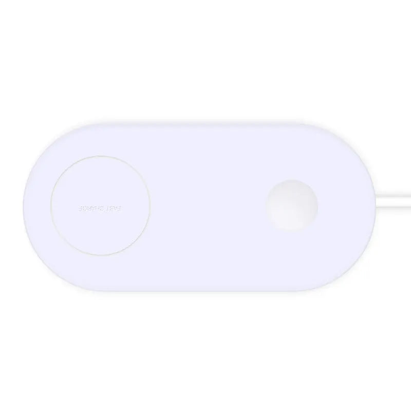 White dual wireless charger charging two mobile phones simultaneously on simple desk