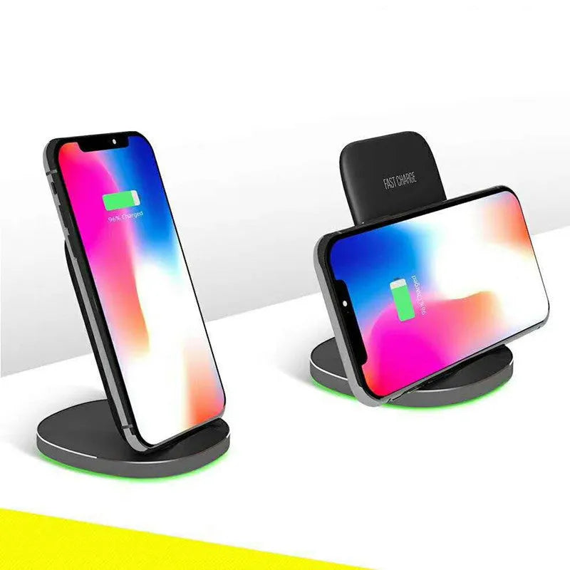 Vertical wireless charging dock in white or black colour on a desk charging a smartphone