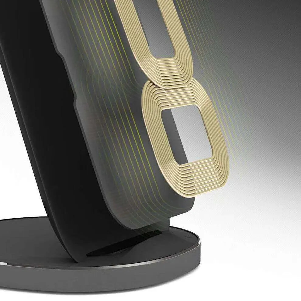 Vertical wireless charging dock in white or black colour on a desk charging a smartphone