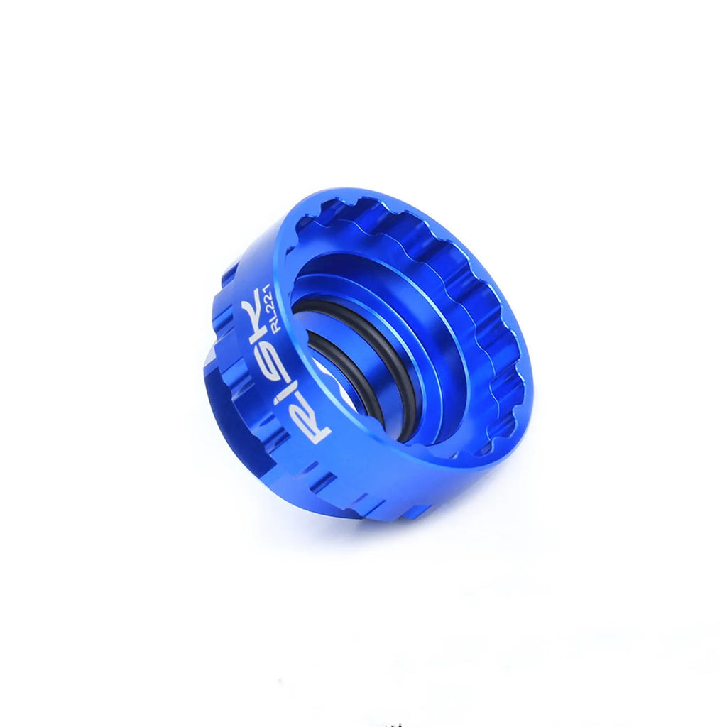 Blue aluminium alloy 12-speed direct mount disc brake removal tool on a workshop bench