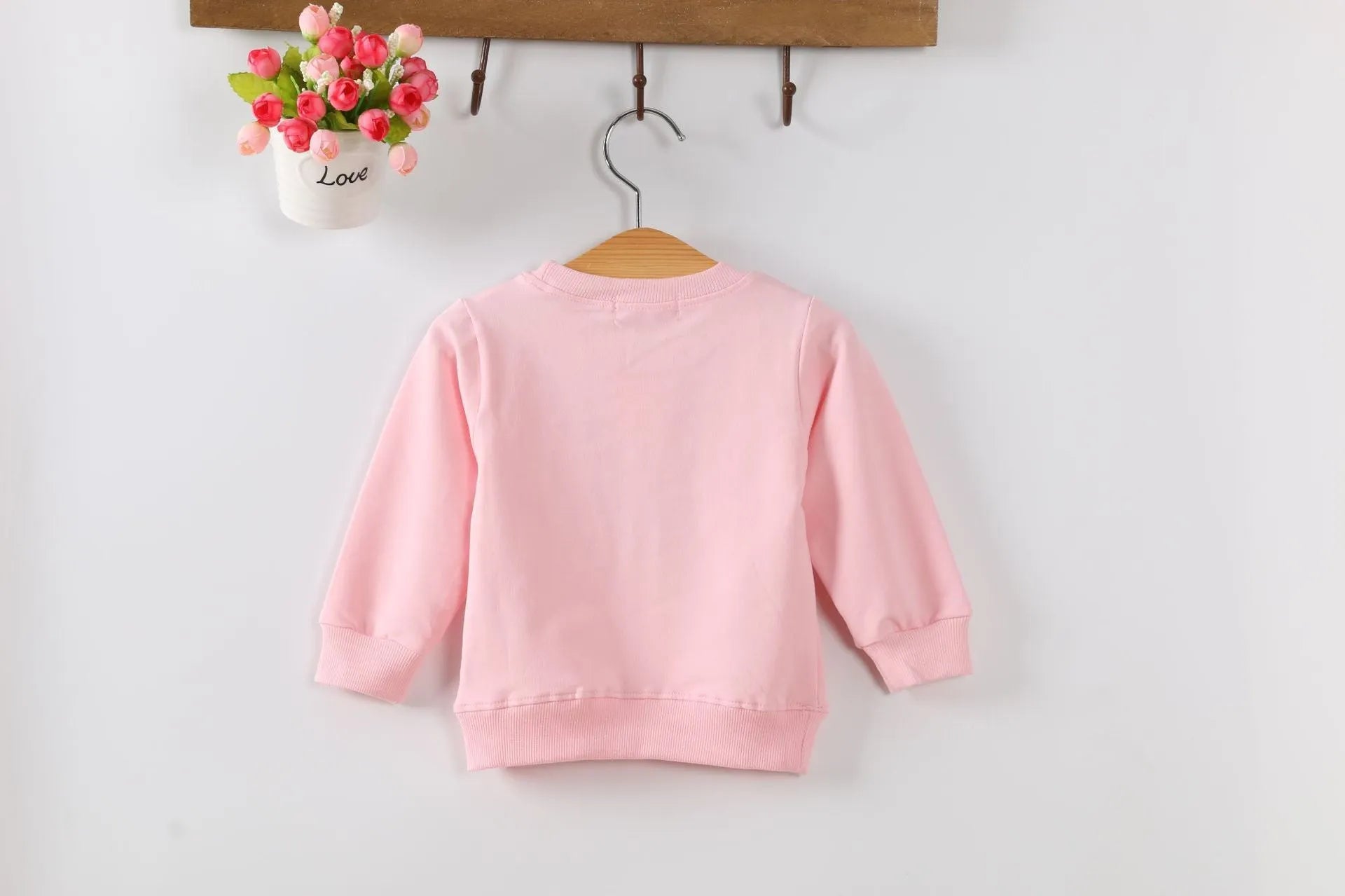 Korean-style baby girl autumn sweater with cartoon pattern in soft-treated fabric