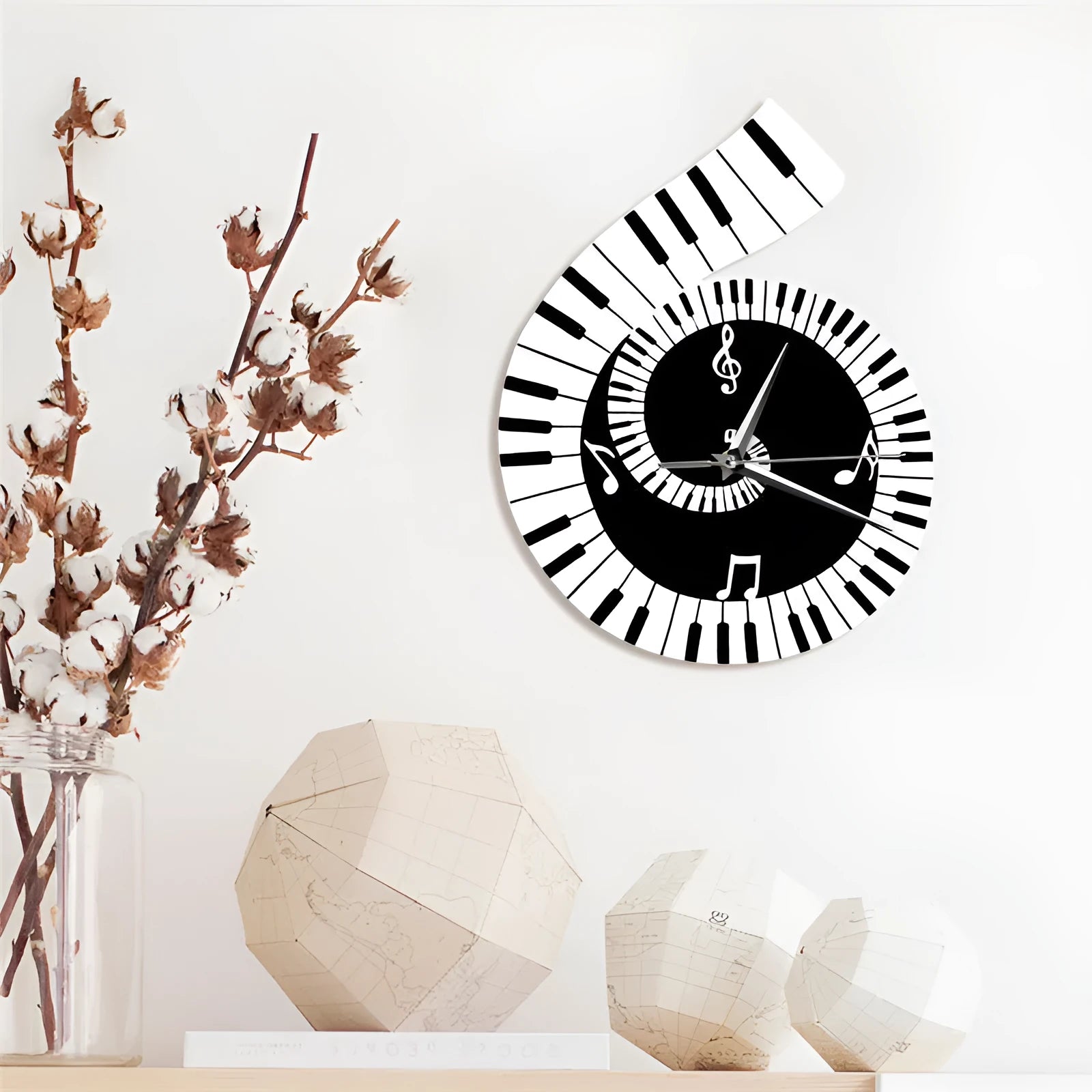 Irregular shaped black and white wall clock with treble clef, piano keyboard, and musical note decoration.