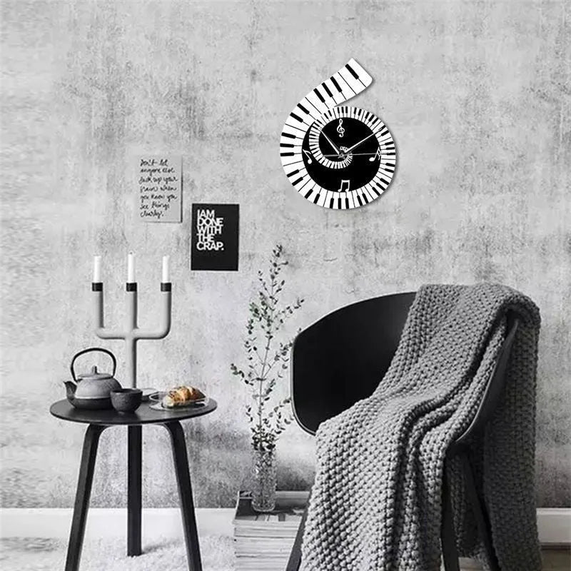 Irregular shaped black and white wall clock with treble clef, piano keyboard, and musical note decoration.