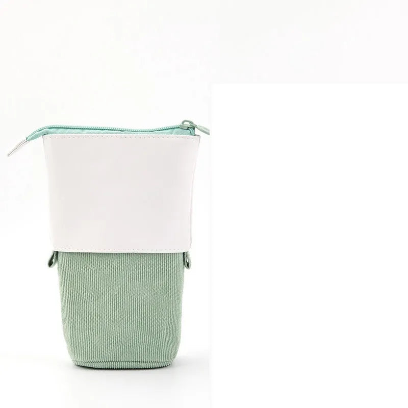 Multifunctional creative corduroy retractable pencil case round shape in green with PU leather trim on desk