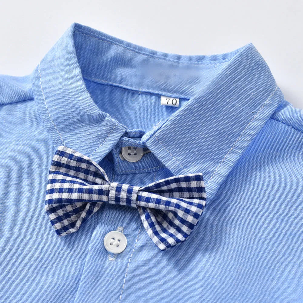 A boy's blue or white gentleman bib pant suit with long sleeves, trousers, and a matching bow tie.