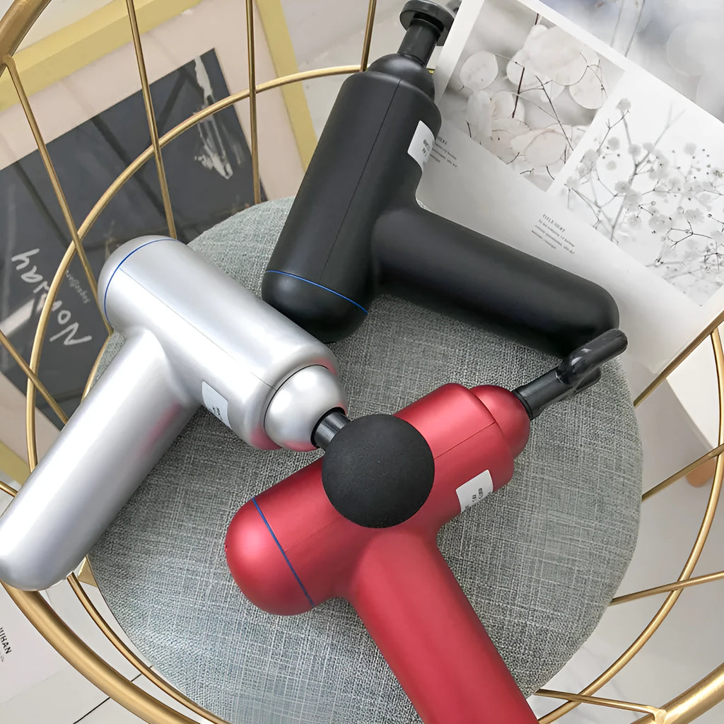 Black handheld USB fascia gun massager with 24W motor on a grey background.