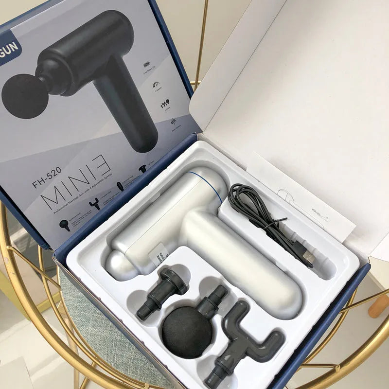 Black handheld USB fascia gun massager with 24W motor on a grey background.
