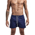Three-point beach pants in polyester, straight loose sports shorts with multi-pocket detail, plain casual style for summer