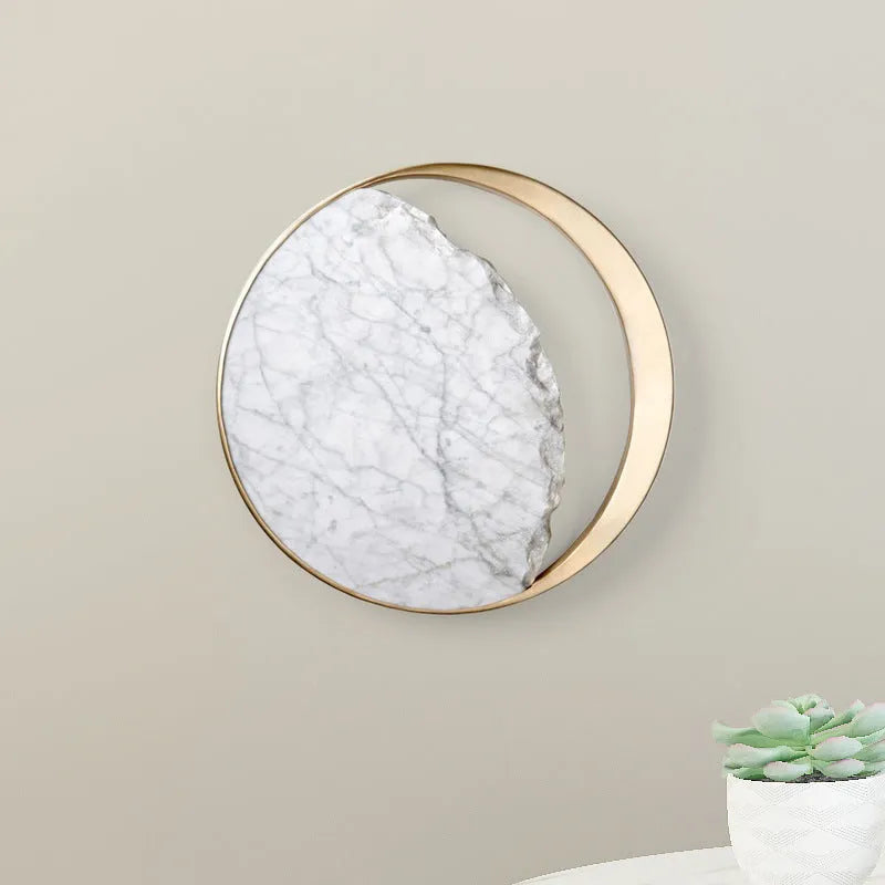 Round marble and copper Eclipse LED wall sconce with a diameter of 25cm.
