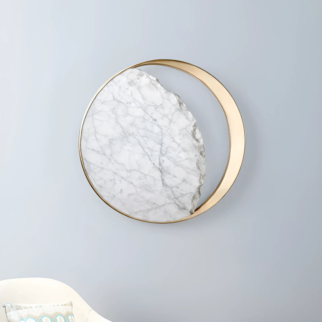 Round marble and copper Eclipse LED wall sconce with a diameter of 25cm.