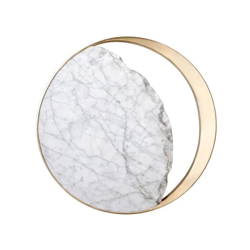 Round marble and copper Eclipse LED wall sconce with a diameter of 25cm.